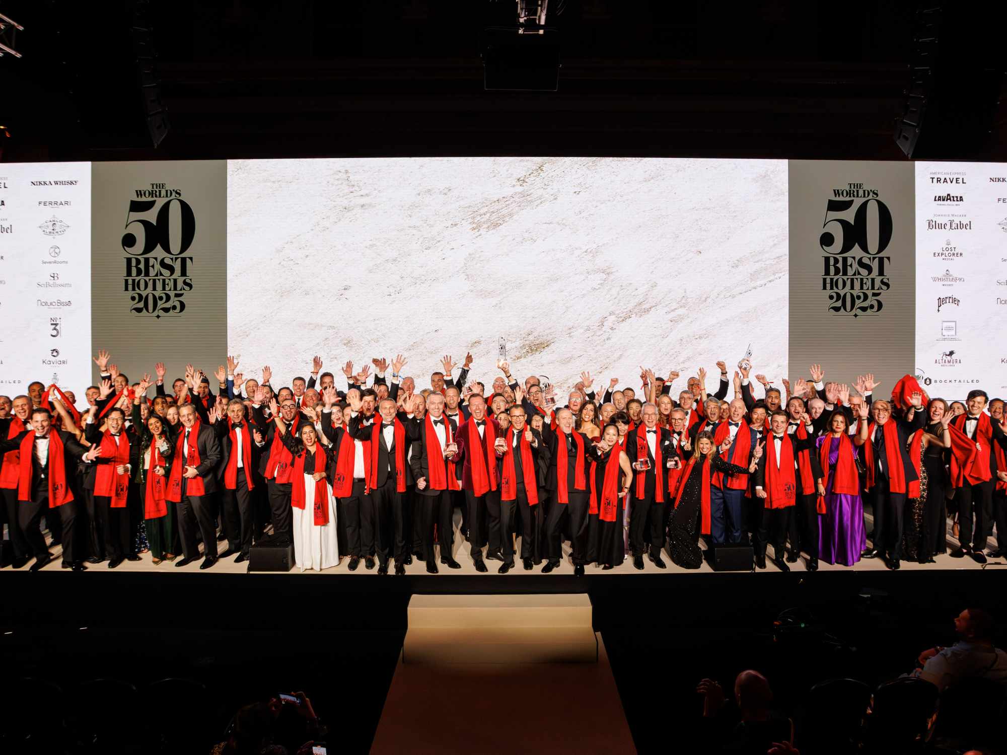 Group photo celebrating the World’s Best 50 Hotels, featuring representatives and leaders from the top 50 properties from around the globe, gathered on stage at the awards ceremony in London.