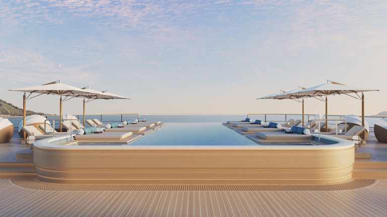 Luxury swimming pool on Amangati’s upper deck with sun loungers and sea views.