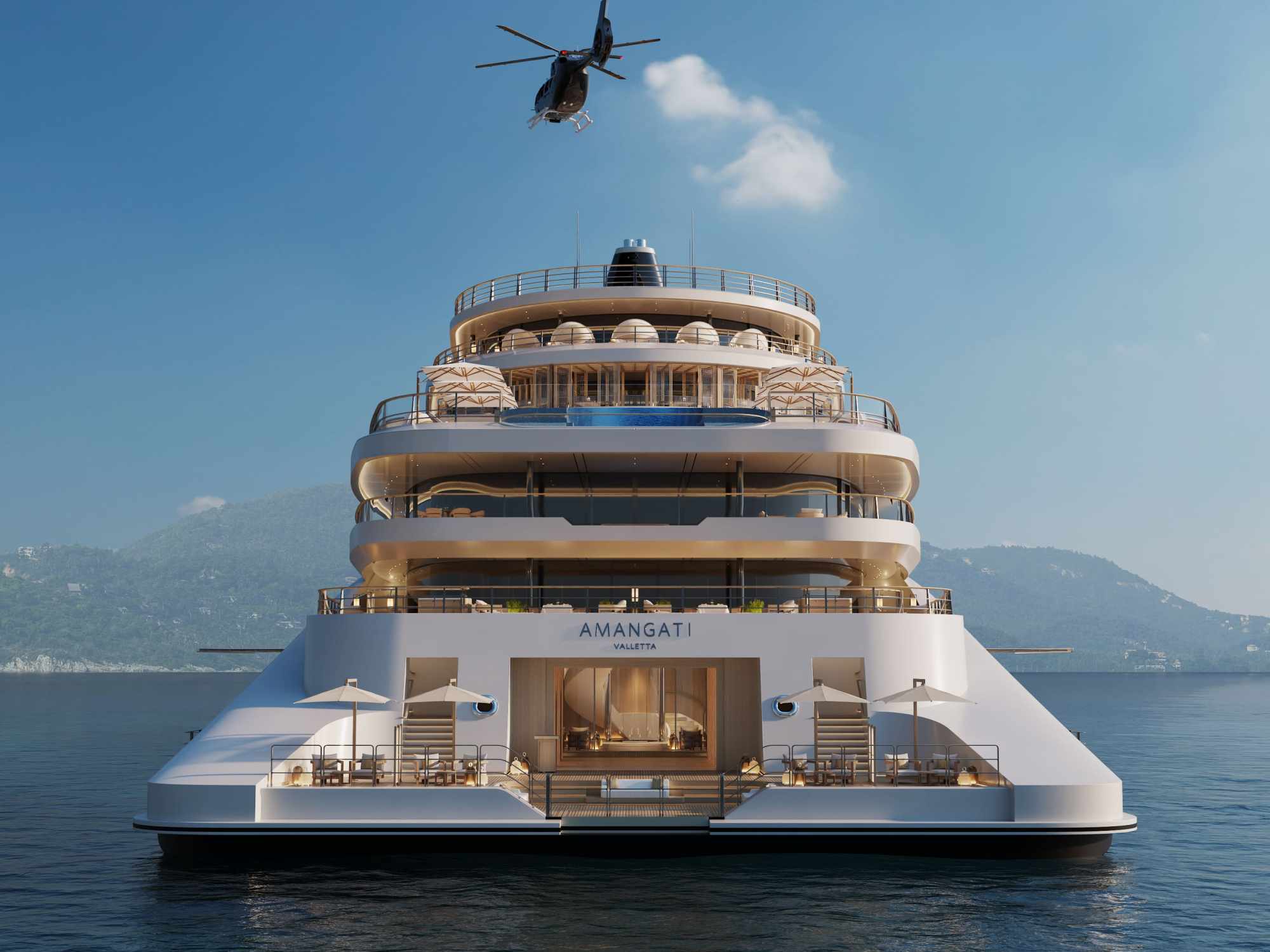 Aman’s new superyacht Amangati at sea with a helicopter flying overhead.