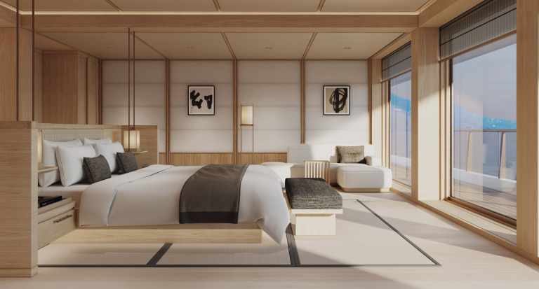 Interior of an Amangati suite with floor-to-ceiling windows and contemporary design.