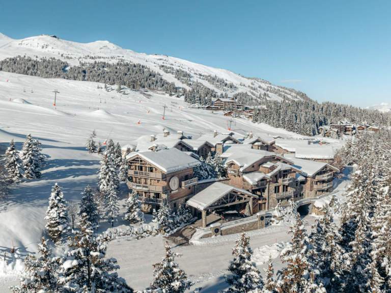 Exterior view of Le K2 Altitude in Courchevel, set directly on the slopes with true ski-in ski-out access in the heart of Courchevel 1850.