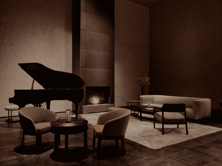 Inside the lobby of Aman Rosa Alpina, featuring warm wood interiors, soft lighting, and a grand piano that anchors the hotel’s refined alpine atmosphere.