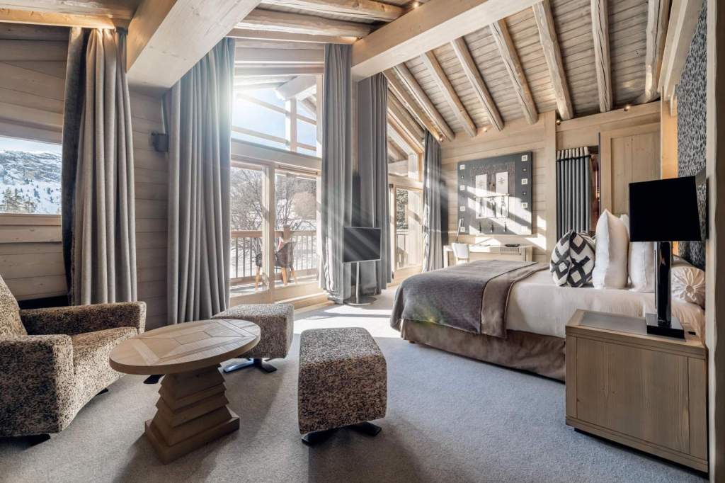 Inside a luxurious suite at Le K2 Altitude, showcasing refined alpine design, generous space, and one of the hotel’s most distinctive accommodation experiences.