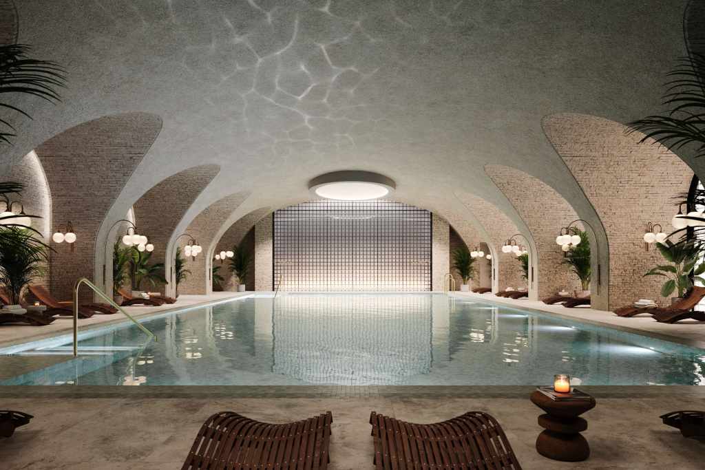 Six Senses London spa interior with indoor pool inside the restored Whiteley building in Bayswater