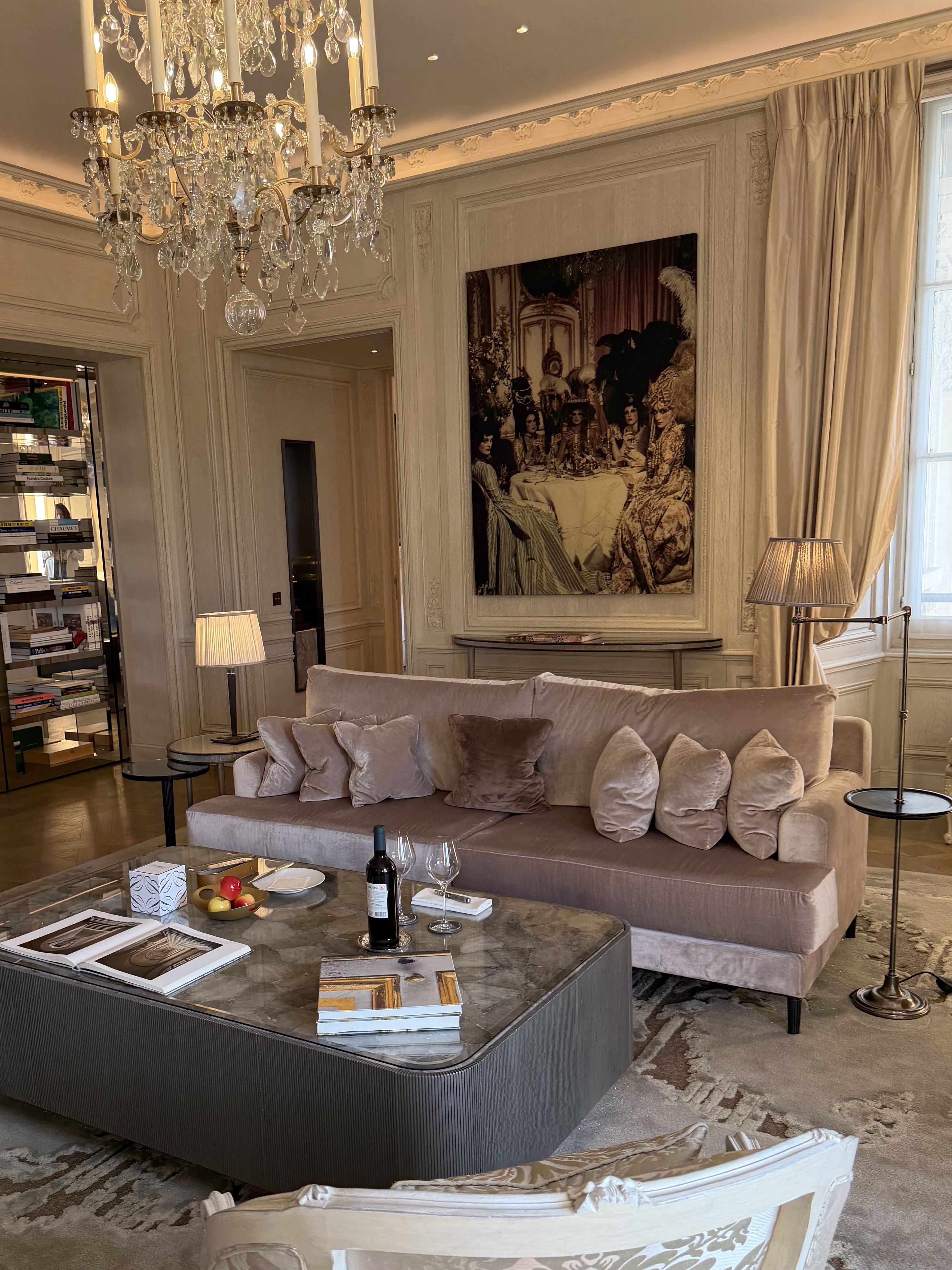 Interior of the Karl Lagerfeld-designed Les Grands Appartements at Hôtel de Crillon in Paris, showcasing refined contemporary luxury with sculptural furniture, monochrome accents, high ceilings, and a sophisticated blend of historic Parisian architecture and modern design.