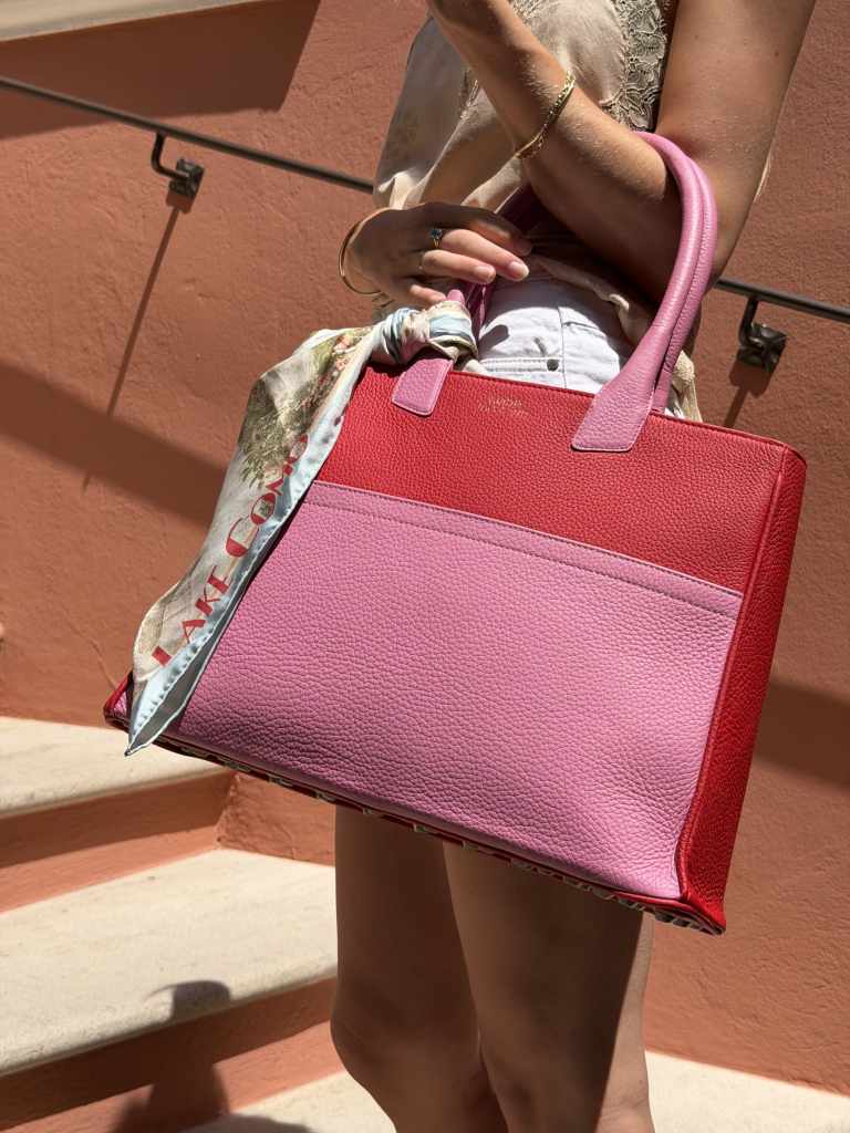 Pink and red LUC8K Tote styled with a silk scarf at Hôtel Byblos in Saint-Tropez